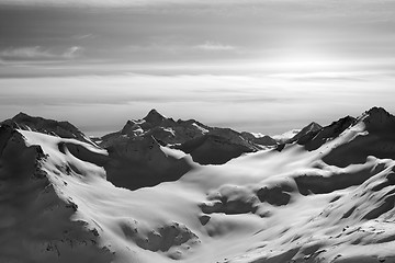 Image showing Black and white snowy mountains in evening
