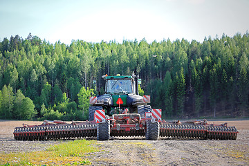 Image showing John Deere Tracked Tractor and Cultivator on Field, Rear View 