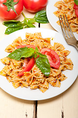 Image showing Italian pasta farfalle butterfly bow-tie and tomato sauce