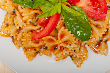 Image showing Italian pasta farfalle butterfly bow-tie and tomato sauce