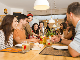 Image showing Friends lunching at the restaurant