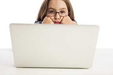 Image showing Little girl working with a laptop