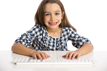 Image showing Little girl working with a computer