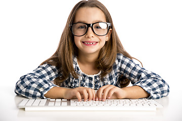 Image showing Little girl working with a computer