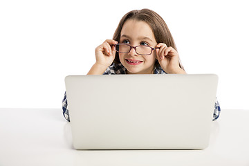 Image showing Little girl working with a laptop