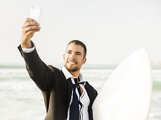 Image showing Businessman makifn a selfie