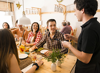 Image showing Group of friends at the restaurant