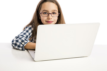 Image showing Little girl working with a laptop
