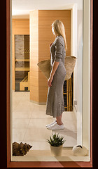 Image showing Gorgeous woman entering spa center