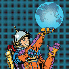 Image showing Retro astronaut is holding the planet Earth on hand