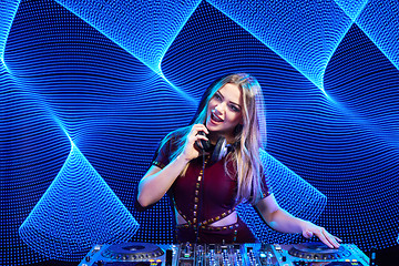 Image showing DJ girl on decks at the party