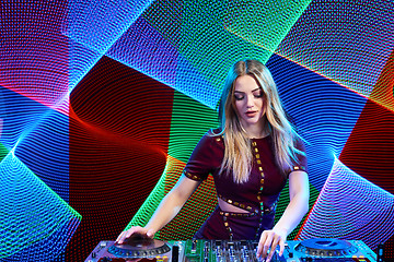 Image showing DJ girl on decks at the party