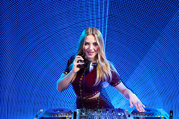 Image showing DJ girl on decks at the party