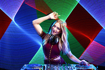 Image showing DJ girl on decks at the party