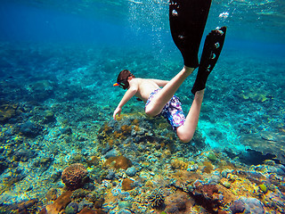 Image showing Underwater shoot of a young boy snorkeling