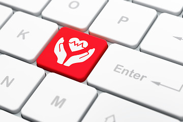 Image showing Insurance concept: Heart And Palm on computer keyboard background