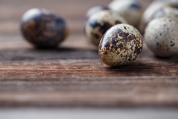 Image showing Group of quail eggs on thewooden background