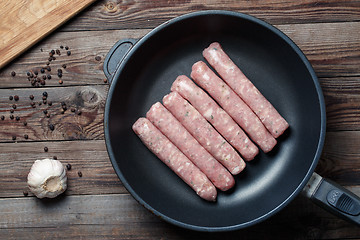 Image showing Raw Sausages in a Pan