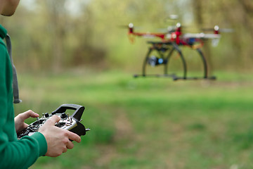 Image showing Man controling a drone.