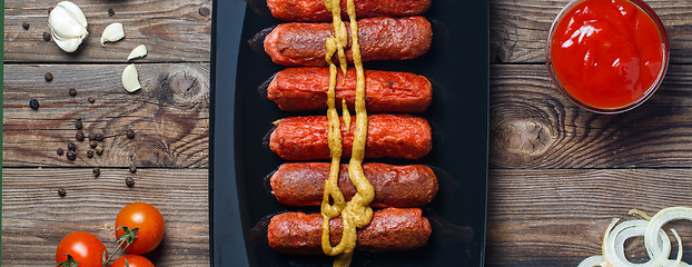 Image showing Sausage roasted on the grill.