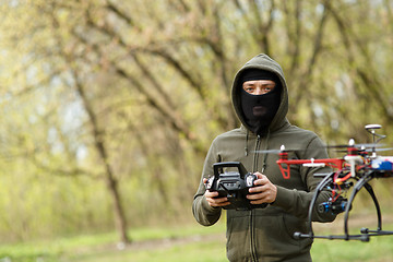 Image showing Man flying with the drone