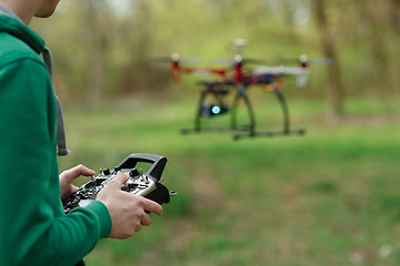 Image showing Man controling a drone.
