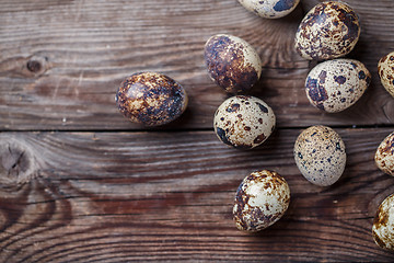 Image showing Group of quail eggs on thewooden background