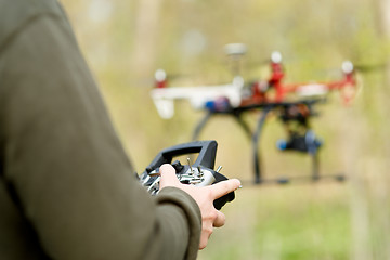 Image showing Man controling a drone.