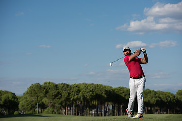 Image showing golf player hitting long shot