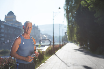 Image showing portrait of handsome senior jogging man