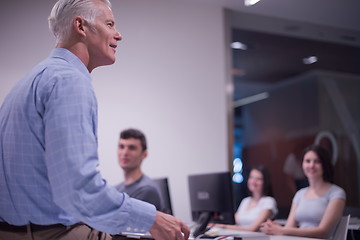 Image showing teacher and students in computer lab classroom