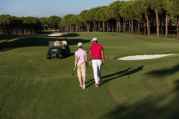 Image showing couple walking on golf course