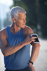 Image showing portrait of handsome senior jogging man