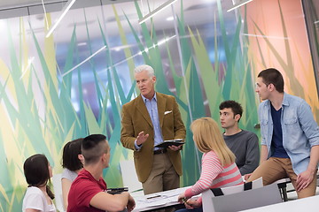 Image showing teacher with a group of students in classroom