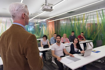 Image showing teacher with a group of students in classroom