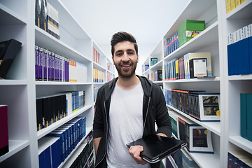 Image showing student with tablet in library