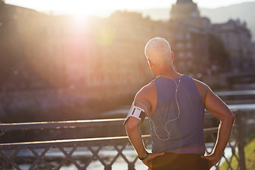 Image showing portrait of handsome senior jogging man