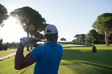 Image showing golf player hitting shot