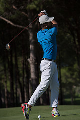 Image showing golf player hitting shot