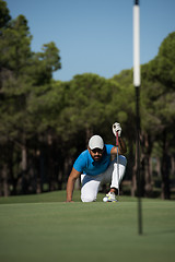 Image showing golf player aiming perfect  shot