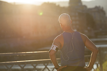 Image showing portrait of handsome senior jogging man