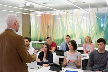 Image showing teacher with a group of students in classroom