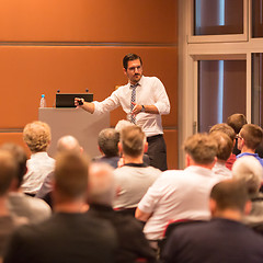 Image showing Business speaker giving a talk in conference hall.