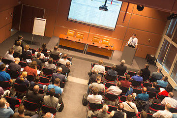 Image showing Business speaker giving a talk in conference hall.