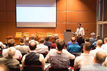 Image showing Business speaker giving a talk in conference hall.