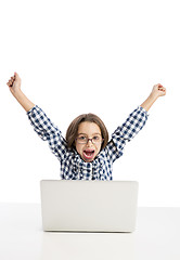 Image showing Little girl working with a laptop