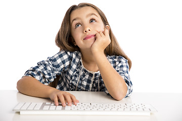 Image showing Little girl working with a computer