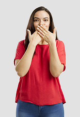 Image showing Lovely woman with hands on mouth