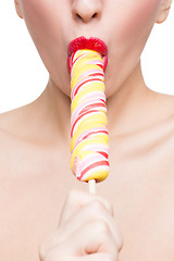 Image showing Close-up shot of woman\'s mouth bright red lips with lollipop. blowjob simulation