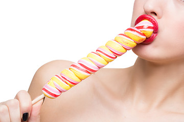 Image showing Close-up shot of woman\'s mouth bright red lips with lollipop. blowjob simulation